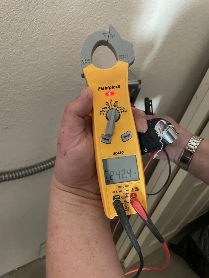 Voltage testing with clamp meter during Generator Installation in Everett